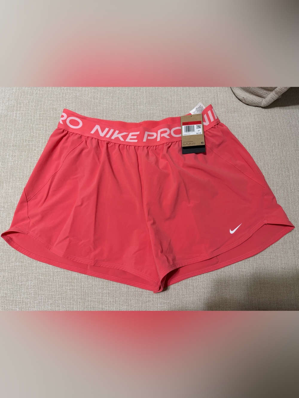 Nike Women’s Coral Pink Athletic Shorts with 'NIKE PRO' Waistband